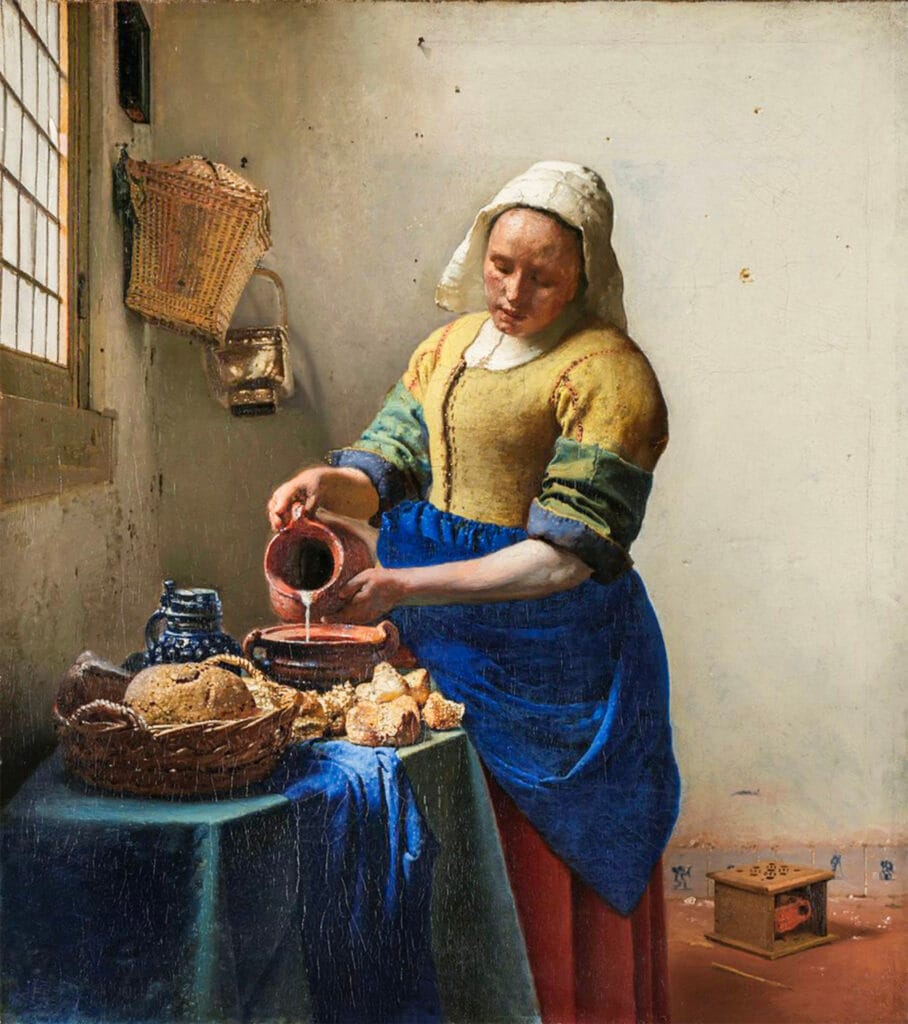 Puzzles Book Experience: Hardcover Feel, Digital Ease 2 A woman in traditional Dutch attire pours milk into a bowl near a sunlit window, surrounded by rustic kitchen items, bread, and a blue cloth in a simple, white-walled room.